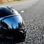 Motorcycle helmet on dark road
