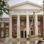 Kennesaw Georgia courthouse and legal scales.