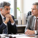Person consulting lawyer in a bright office setting