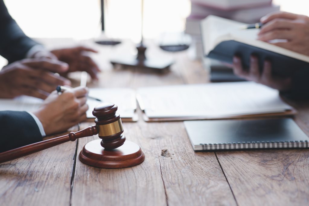 Finding the Right Car Accident Lawyer: Essential Tips for Springfield Residents 3 a judge's gavel and a person sitting at a table