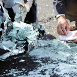 Lawyer examining car crash evidence.