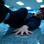 Person slipping on wet floor in public building