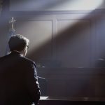 Witness testifying in a courtroom during an injury case.